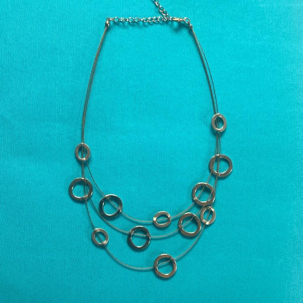 Gold tone “Floating” necklace